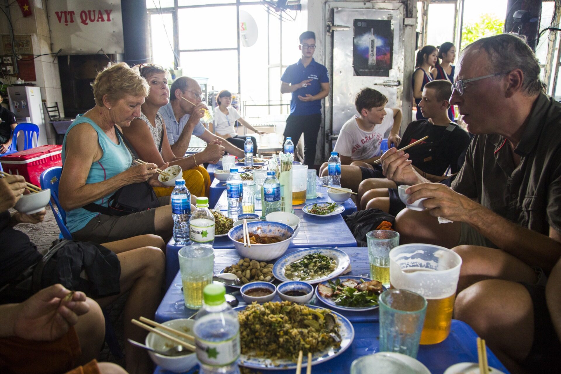 Tourists enjoying street food in Saigon