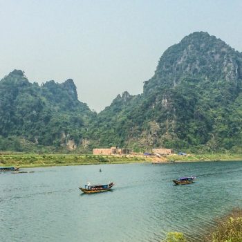 Beautiful Dong Hoi river with mountains in the background
